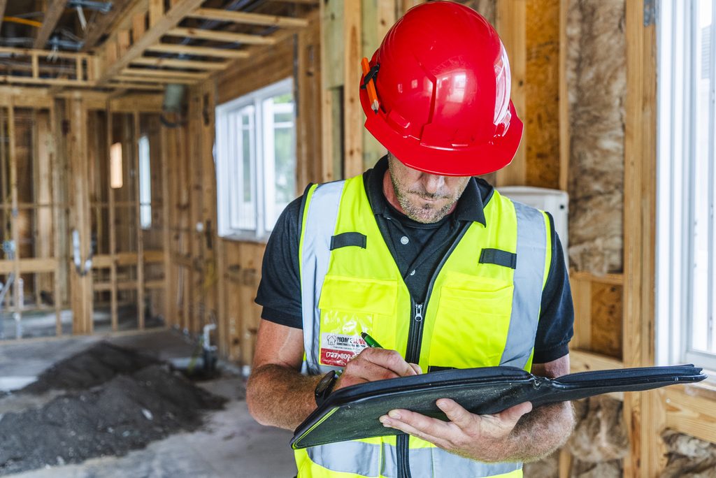 Home Love Construction contractor reviewing a home renovation timeline